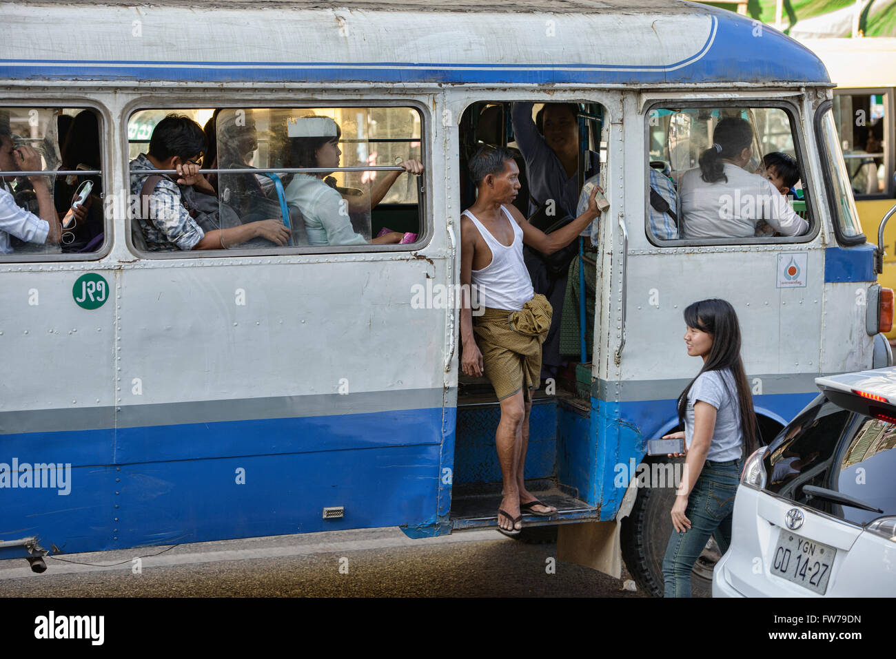 Passengers on a bus, Yangon, Myanmar Stock Photo