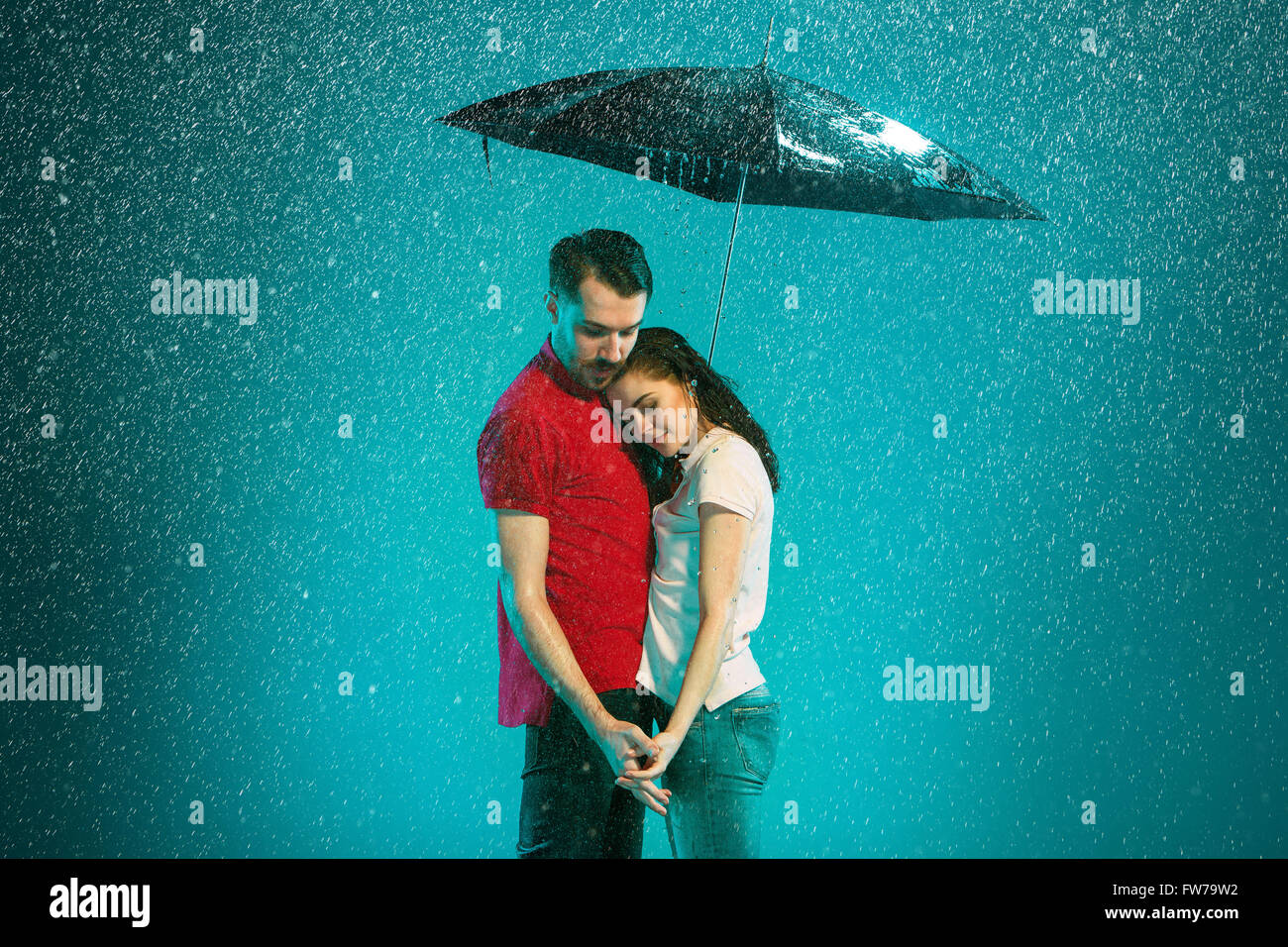 The loving couple in the rain Stock Photo - Alamy