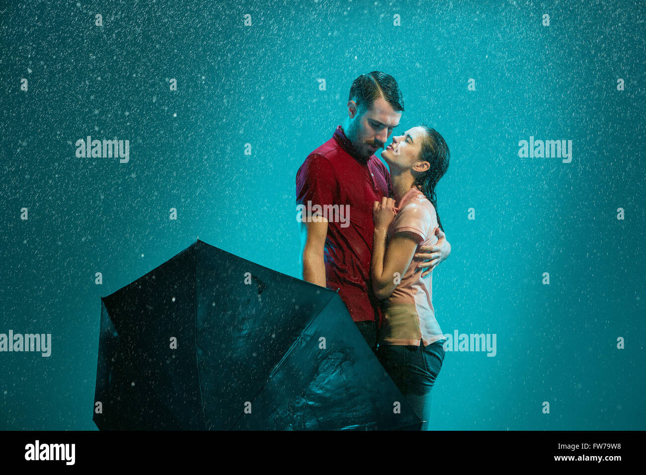 The loving couple in the rain Stock Photo - Alamy
