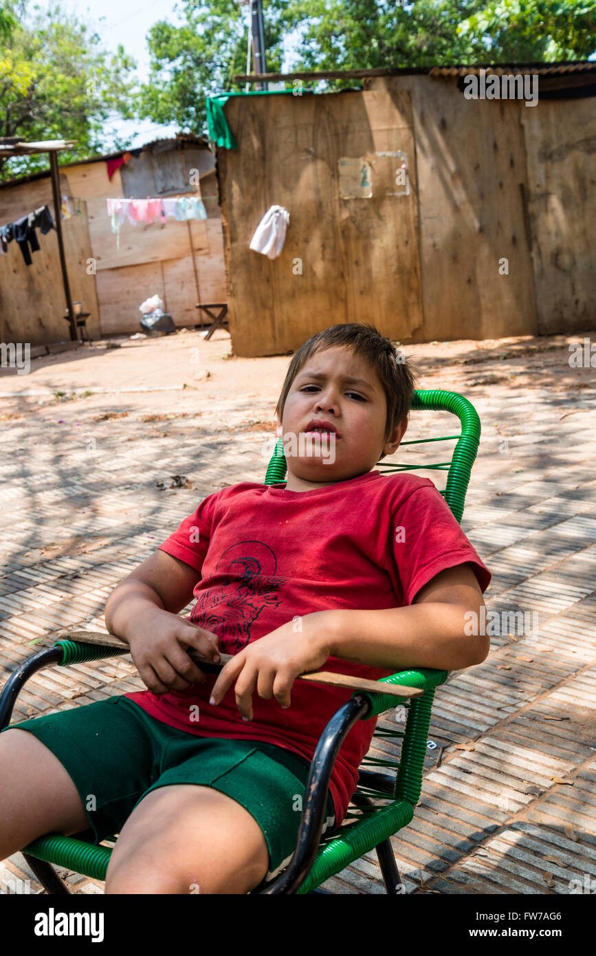 Guarani child in makeshift camp at Plaza de la Independencia, Asunción, Paraguay Stock Photo