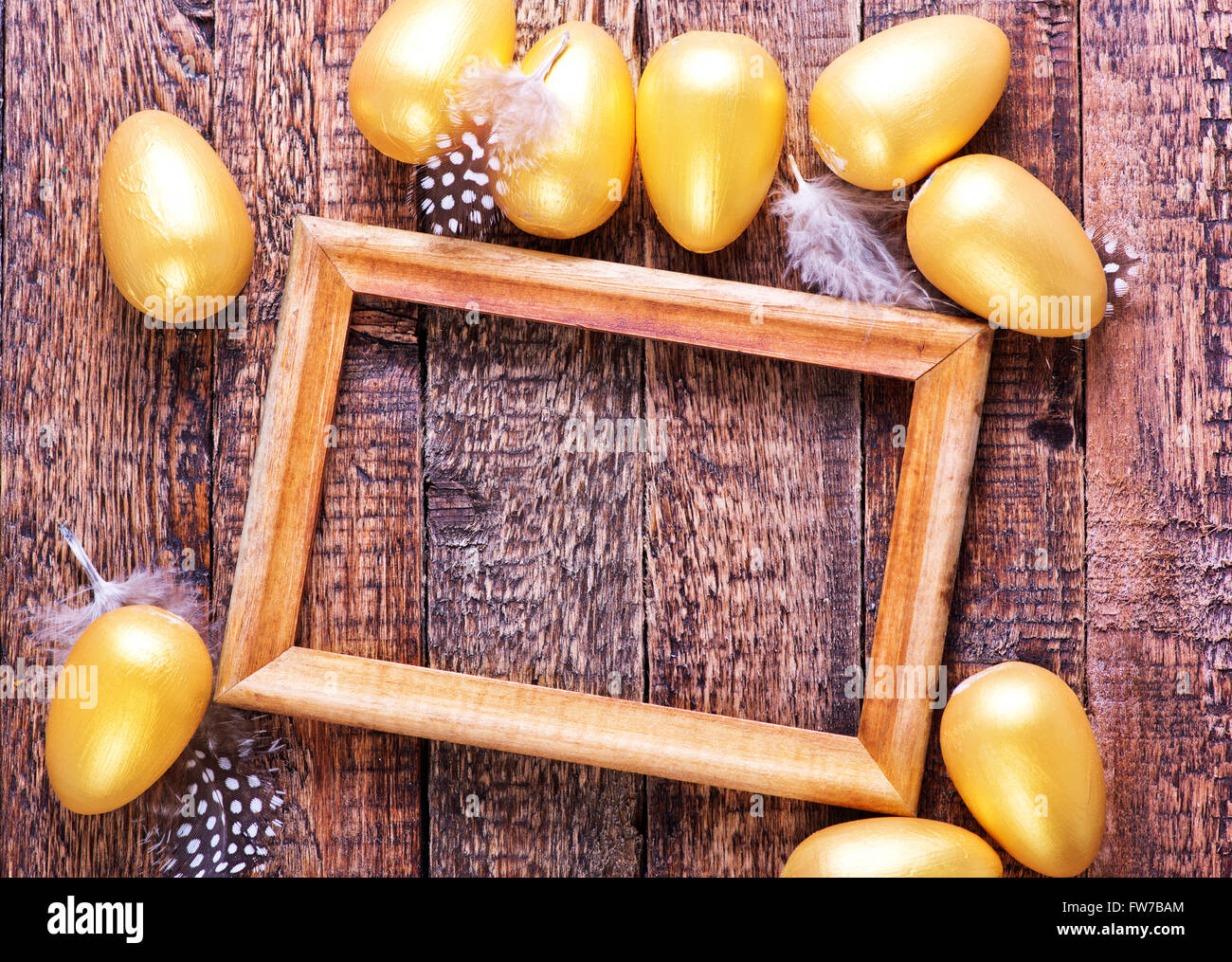golden eggs in nest and on a table Stock Photo - Alamy