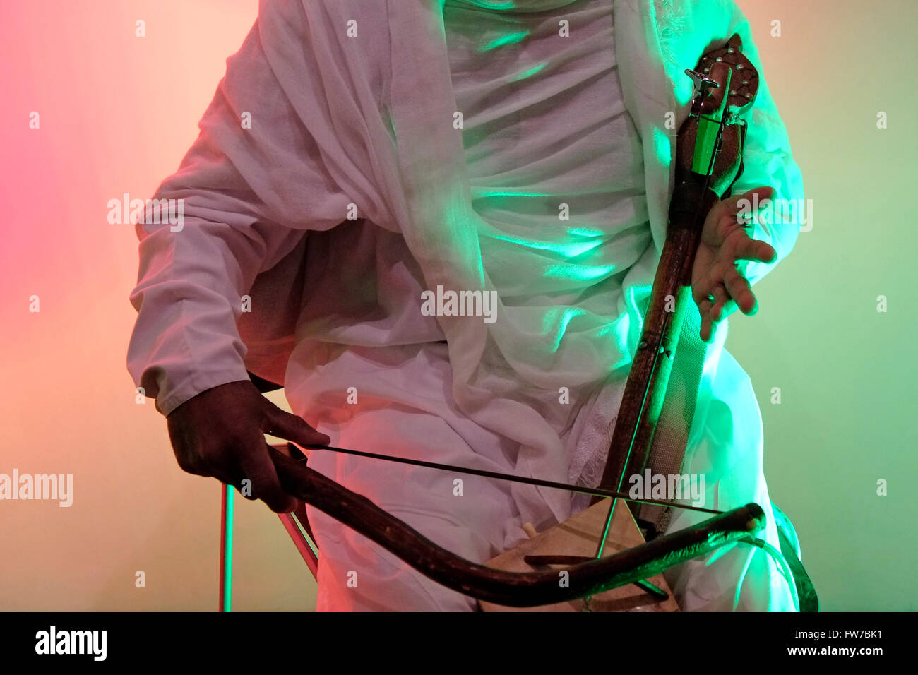 Ethiopian man playing the masenqo also spelled masenko, mesenqo, mesenko,  masinko, or masinqo a single-stringed bowed lute found in the musical  traditions of Ethiopia and Eritrea Stock Photo - Alamy