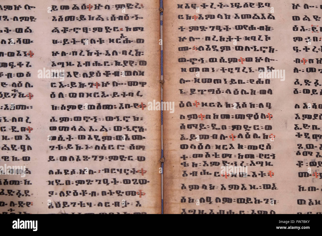 An old Ethiopian Torah, called Orit widely believed to be a translation of a Greek translation of the Bible written on parchment in Geez an ancient South Semitic language that originated in the northern region of Ethiopia and Eritrea. Today, Geez remains only as the main language used in the liturgy of the Ethiopian Orthodox Tewahedo Church, the Eritrean Orthodox Tewahedo Church, the Ethiopian Catholic Church, and the Beta Israel Jewish community. Stock Photo