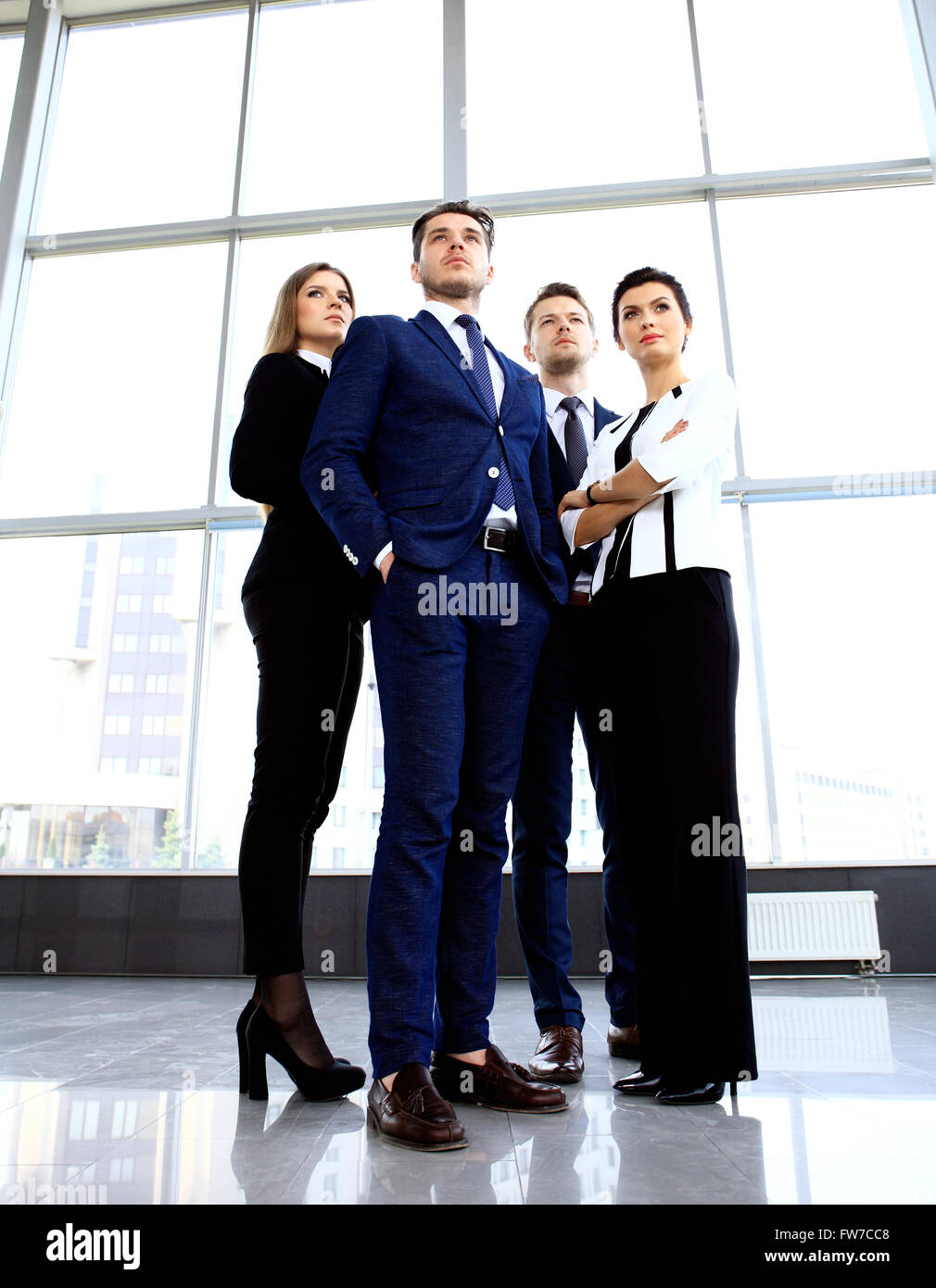 Happy smiling business team Stock Photo - Alamy