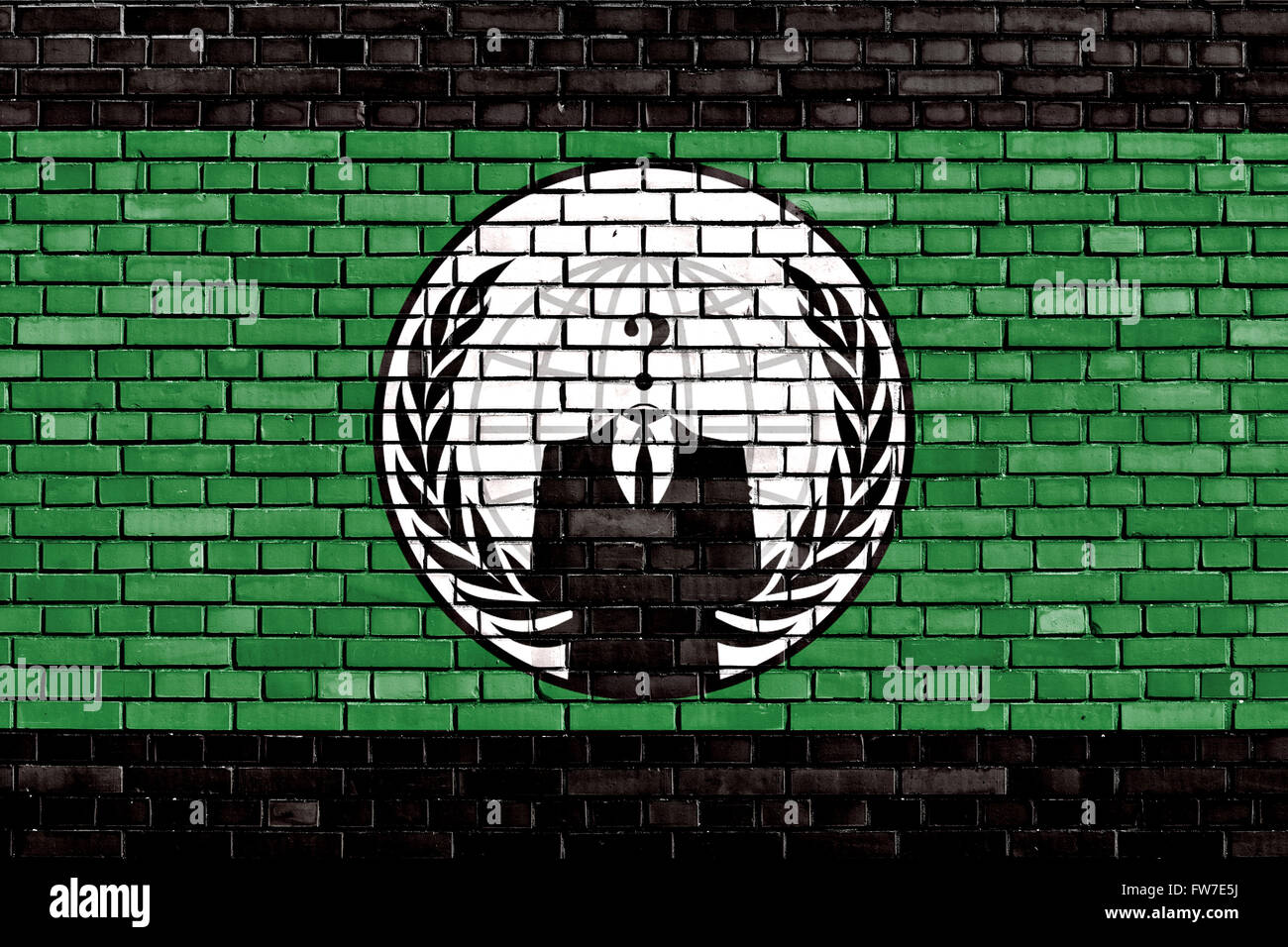 flag of Anonymous painted on brick wall Stock Photo