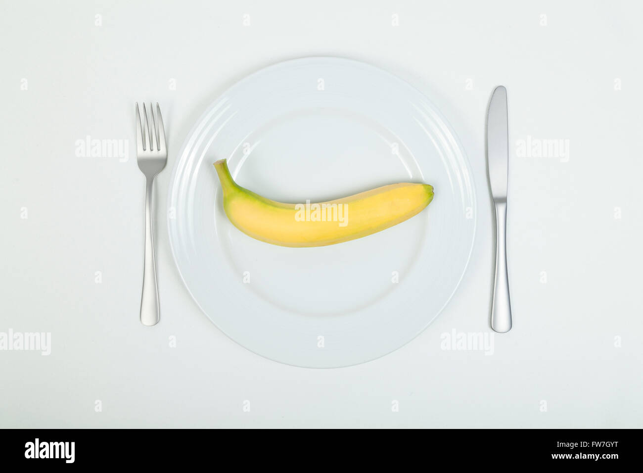 Banana on plate Stock Photo - Alamy