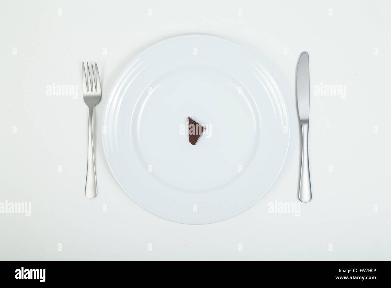 Piece of chocolate on plate Stock Photo