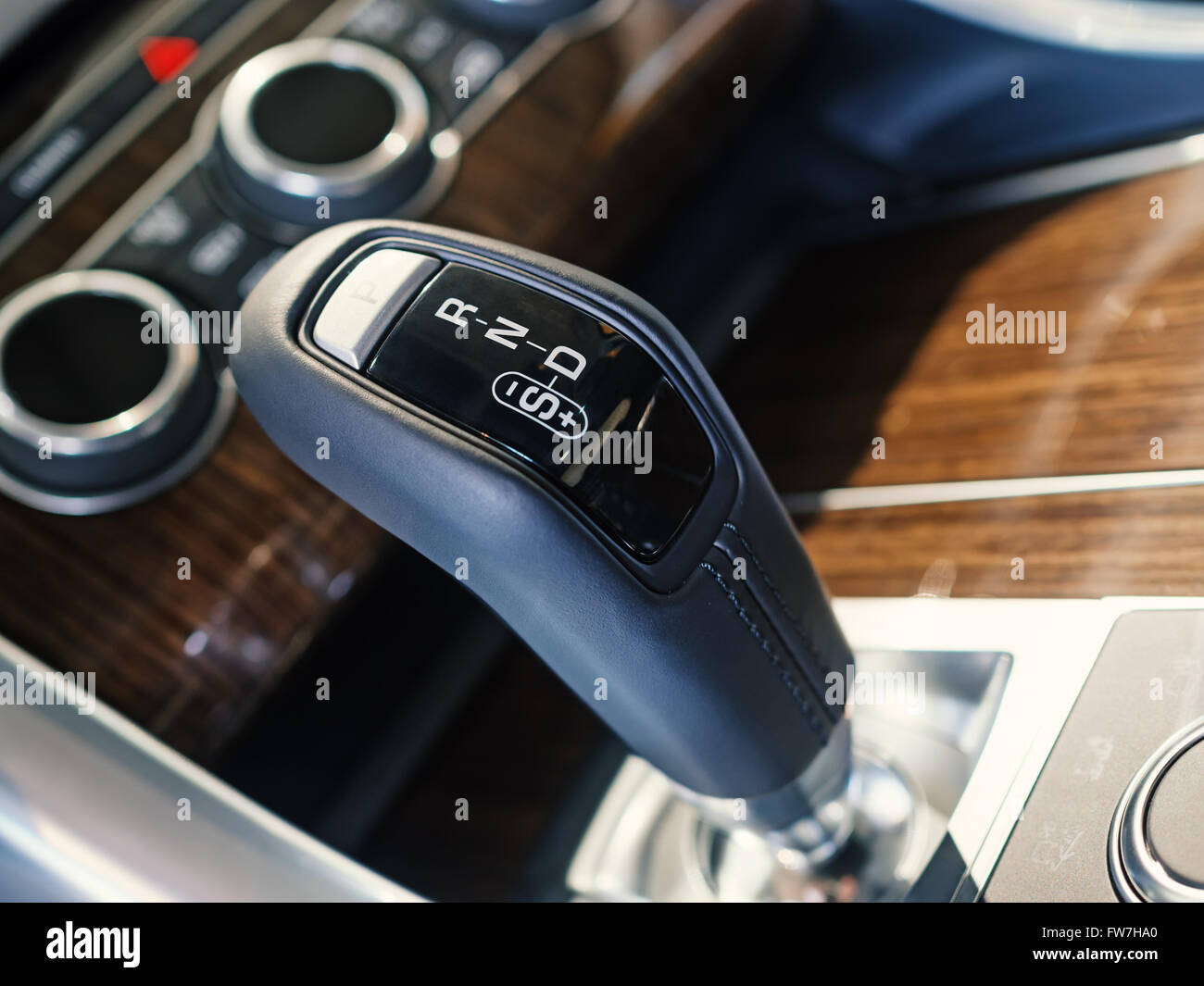 Closeup of automatic transmission gearshift In a luxury SUV, shallow