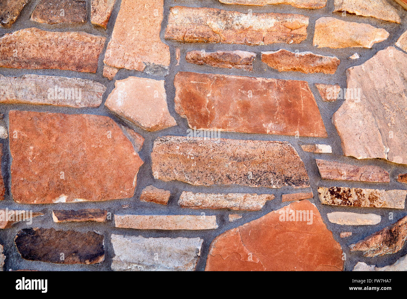 rock stone natural veneer wall sample detail closeup for building industry and home construction manufacturing Stock Photo