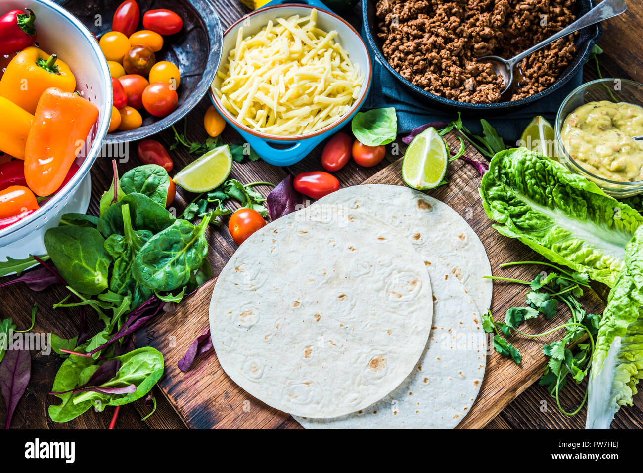 Traditional mexican tortillas or fajita recipe with ingredients on