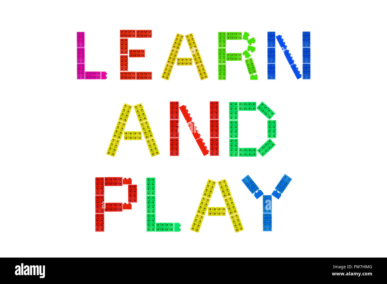 Learn and Play created from Lego pieces photographed against a white background. Stock Photo