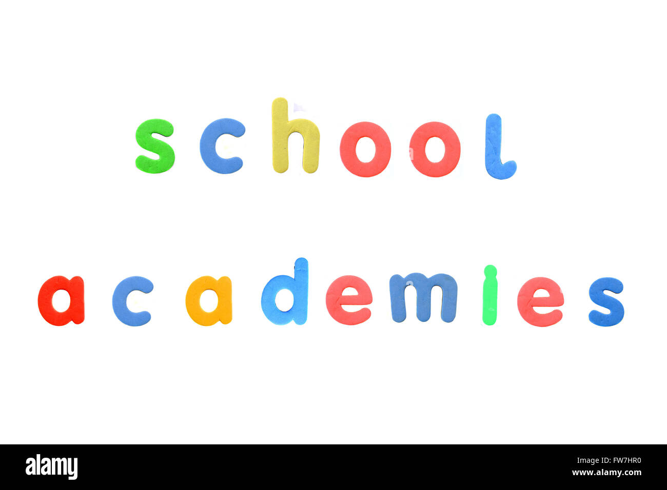 The words School Academies created from magnetic fridge alphabet pieces photographed against a white background. Stock Photo