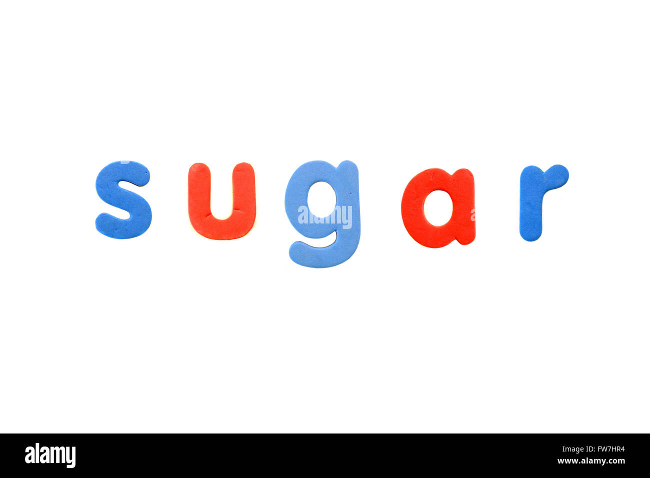 The word Sugar created from magnetic fridge alphabet pieces photographed against a white background. Stock Photo