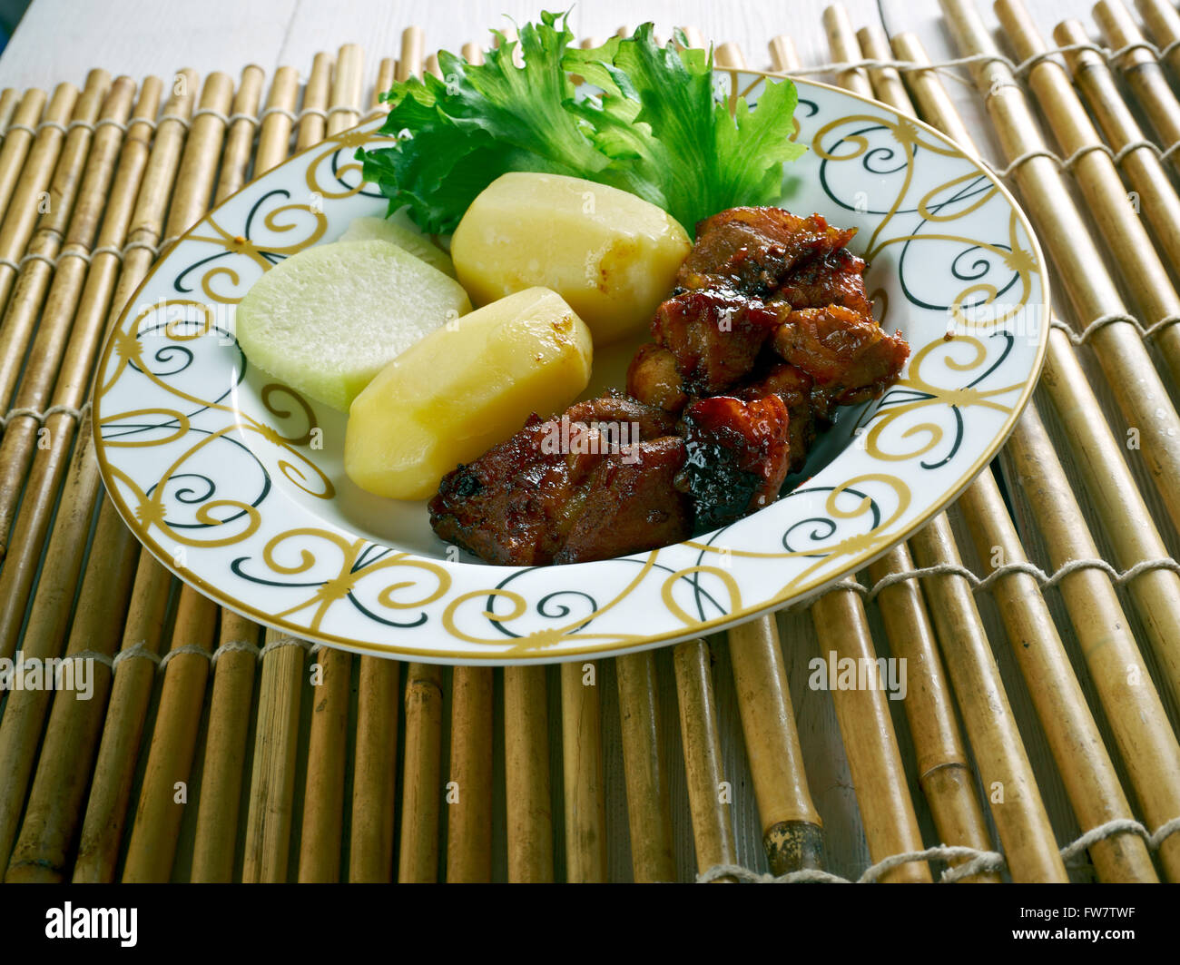 Filipino Braised Pork Adobo.pork cooked in soy sauce, vinegar, and