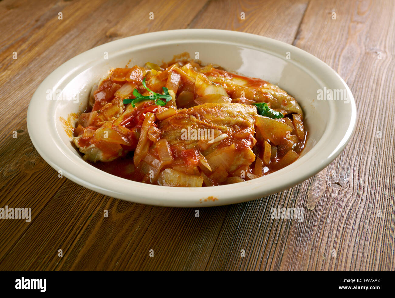 Stew Chicken from Belize.just chicken, red recado, onion, and water. Stock Photo