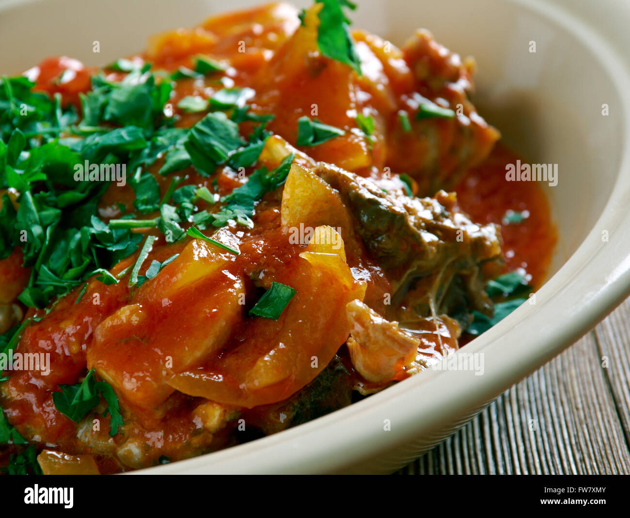 Chicken Marengo -  French dish consisting of a chicken  oil with garlic and tomato. Stock Photo
