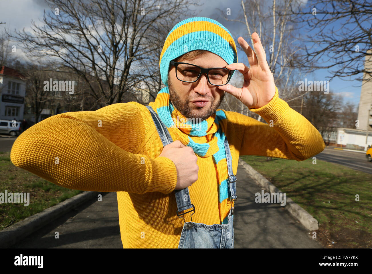 portrait of a young man with glasses and overalls Stock Photo