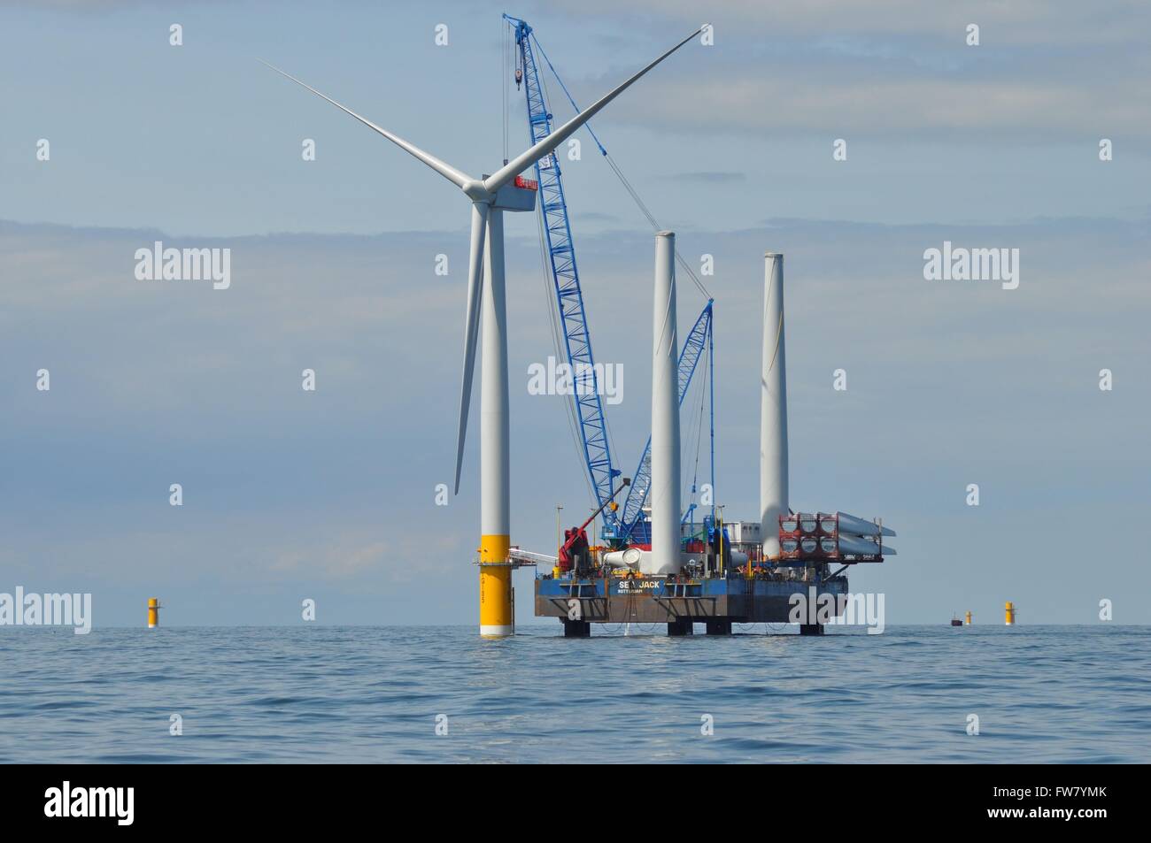 Construction of the offshore wind turbines at the Greater Gabbard wind farm off the coast of Suffolk, England. The alternative energy project was completed in 2012 at a cost of $2 billion dollars. Stock Photo