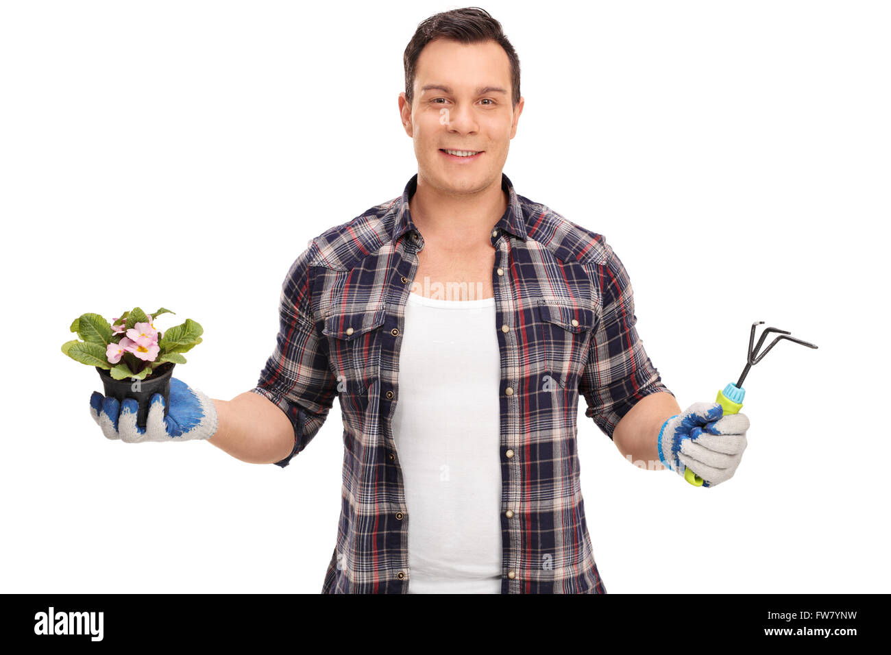 Cheerful gardener holding a flowerpot and a small gardening rake isolated on white background Stock Photo