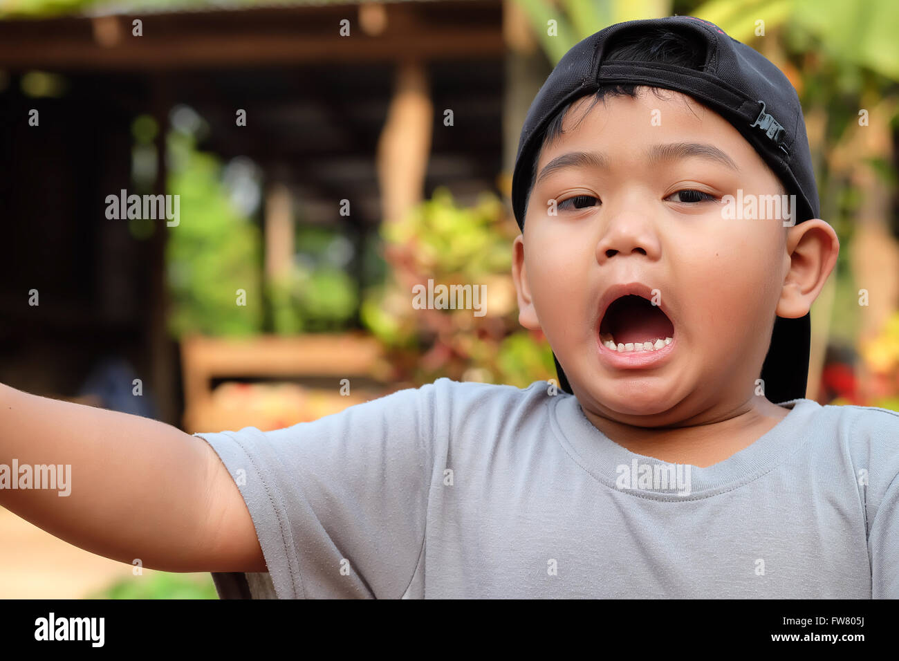 portrait of funny yawning boy -Asia,Thailand children (Selective focus) Stock Photo