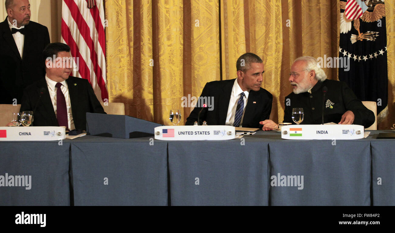 Washington, District of Columbia, USA. 31st Mar, 2016. As President Xi Jinping of the People's Republic of China looks over, United States President Barack Obama talks to Prime Minister Narendra Modi of India at a working dinner with heads of delegations at the Nuclear Security Summit at the White House on March 31, 2016.Credit: Dennis Brack/Pool via CNP Credit:  Dennis Brack/CNP/ZUMA Wire/Alamy Live News Stock Photo