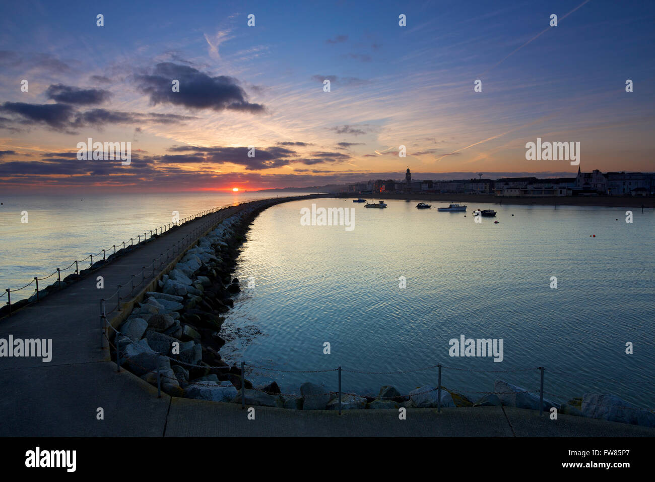 Herne Bay, Kent, UK. 1st April 2016: UK Weather. Sunrise as the rain clouds disappear over Herne bay marina ahead of a weekend of temperatures up to 16C in the south east Credit:  Alan Payton/Alamy Live News Stock Photo