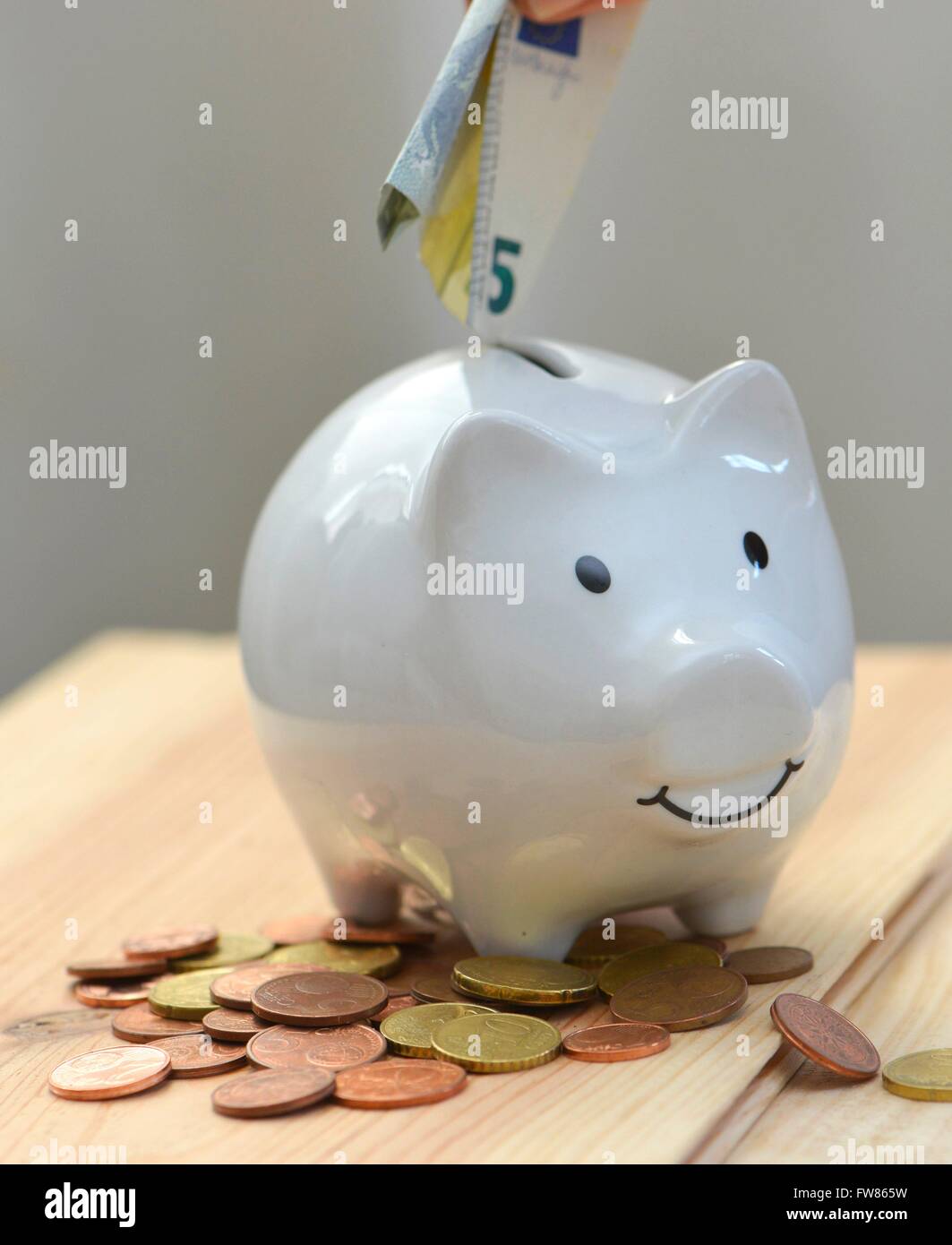 a piggy bank is filled with money, Freiburg, March 1, 2016. Stock Photo