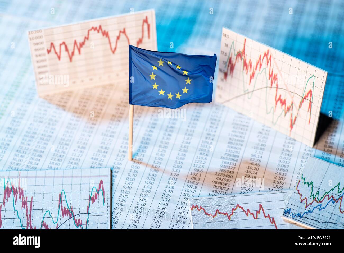 European flag with rate tables and graphs for economic development. Stock Photo