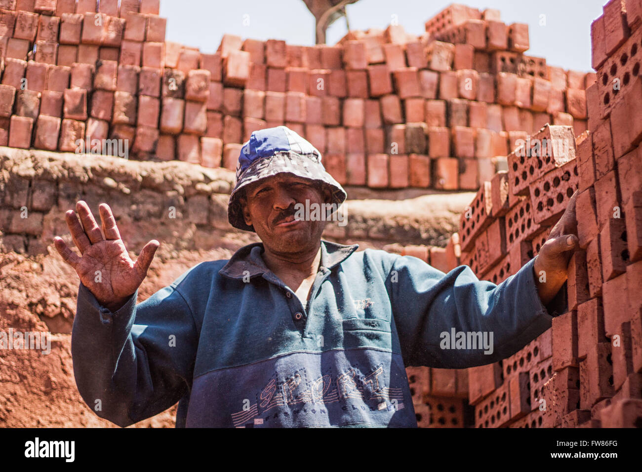 April 1, 2016 - One brick factory worker named Mohammed has a 50-year-old working in a brick factory since a long time and transmits the red bricks to move the bricks outside the factory carts © Fayed El-Geziry/ZUMA Wire/Alamy Live News Stock Photo