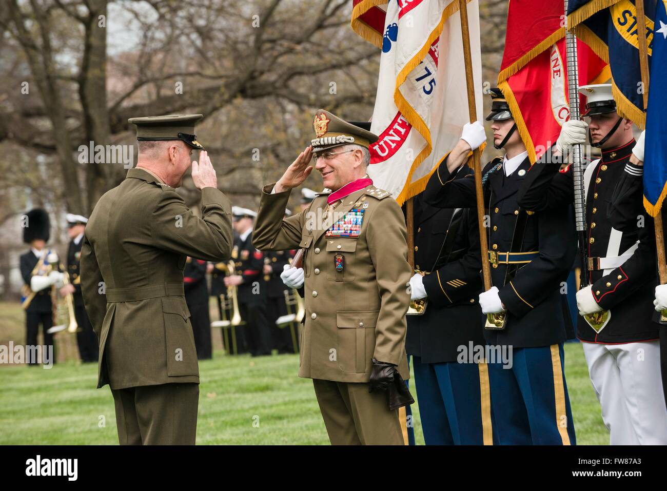 U.S Joint Chiefs Chairman General Joseph F. Dunford Jr. presents the Legion of Merit to Chief of Defense for Italian Armed Forces General Claudio Graziano during a full honors ceremony at Whipple Field on Joint Base Myer-Henderson Hall March 31, 2016 in Arlington, Virginia. Stock Photo