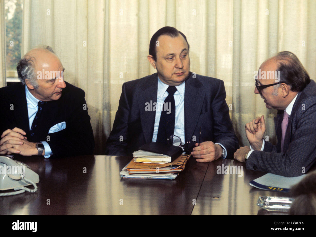 Federal Minister of Interior Hans-Dietrich Genscher (m) with Federal Minister and FDP fellow party member Walter Scheel (l) and chairman of FDP Bundestag faction, Wolfgang Mischnick (r), at a conference of FDP federal executive board on 1st March 1974 in Bonn. Stock Photo