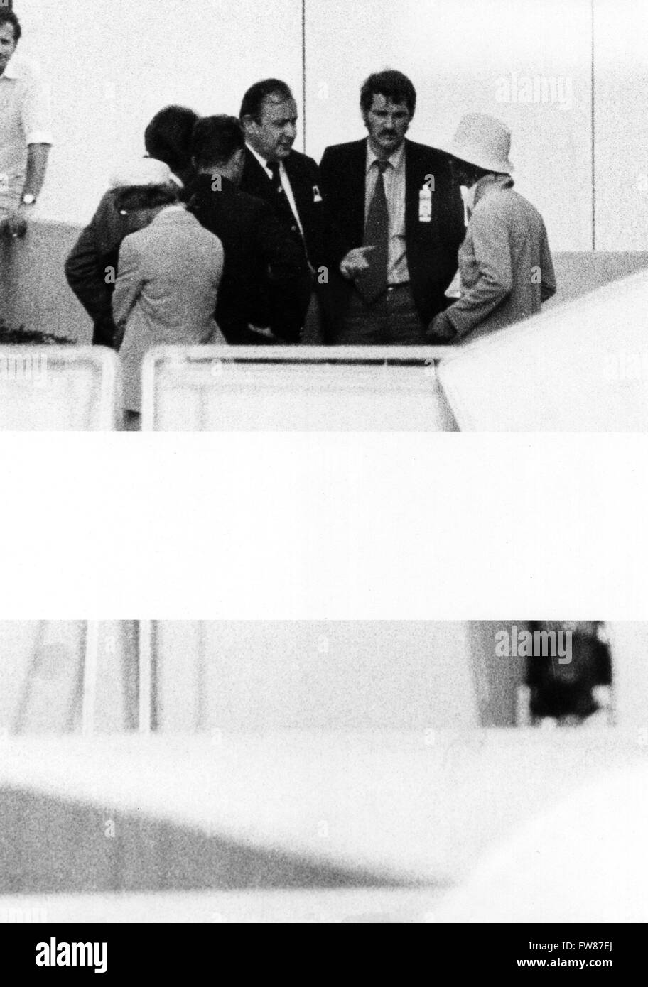 Minister of the Interior Hans-Dietrich Genscher (3rd of right) and further officials negotiate with an Arab terrorist (r) on 05 September 1972 in the Israeli crew's quarters in the Olympic Village during the Olympic Games, where terrorists had violently entered the Village, killed two Israeli athletes and captured nine. Stock Photo