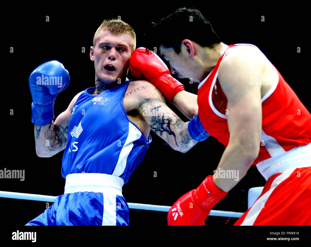 Qian'an, China's Hebei Province. 1st Apr, 2016. Daniel Jason Lewis (L) of Australia competes during the bronze medal match against Shinebayar Narmandakh of Mongolia in the men's 75kg category competition at the Asia/Oceania Zone boxing event qualifier for 2016 Rio Olympic Games in Qian'an, north China's Hebei Province, April 1, 2016. Lewis won 3-0. Credit:  Yang Shiyao/Xinhua/Alamy Live News Stock Photo