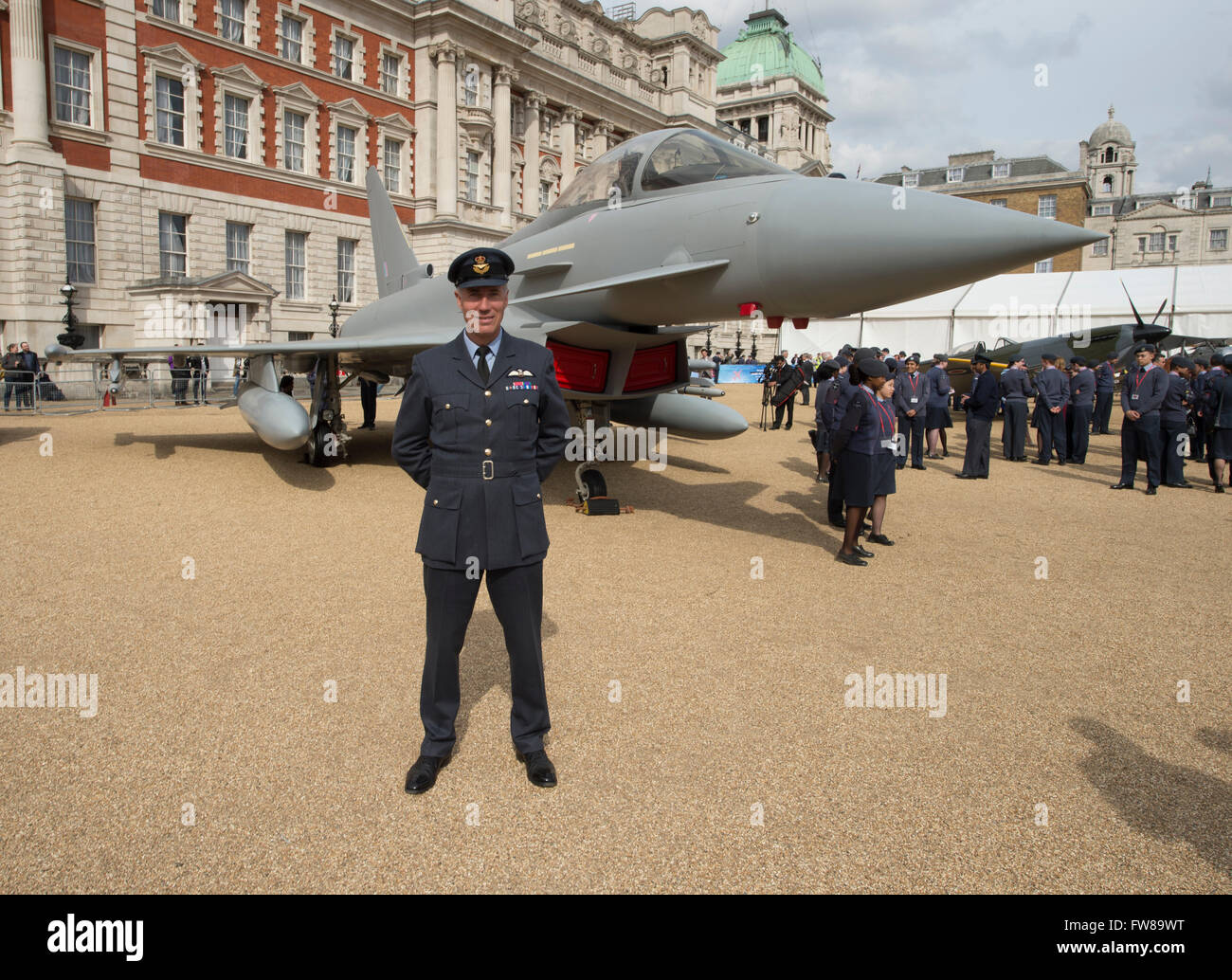Horse Guards Parade, London, UK. 1st April, 2016. Andy Green, world landspeed record holder and RAF fighter pilot stands in front of a modern-day Eurofighter Typhoon, iconic second world war Spitfire fighter and world war 1 Sopwith Snipe in central London to celebrate the RAF Museum’s campaign offering members of the public the opportunity to have their name written on the wings of an RAF Red Arrows Hawk Jet that will fly through the 2017 display season. Credit:  Malcolm Park editorial / Alamy Live News. Stock Photo