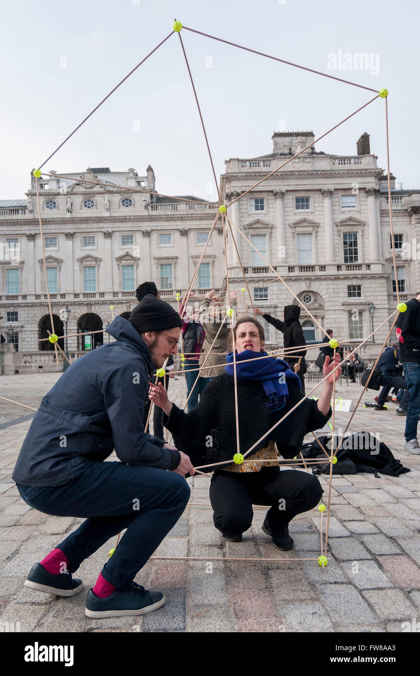 London, UK. 1 April 2016. Members of the public play a game called 