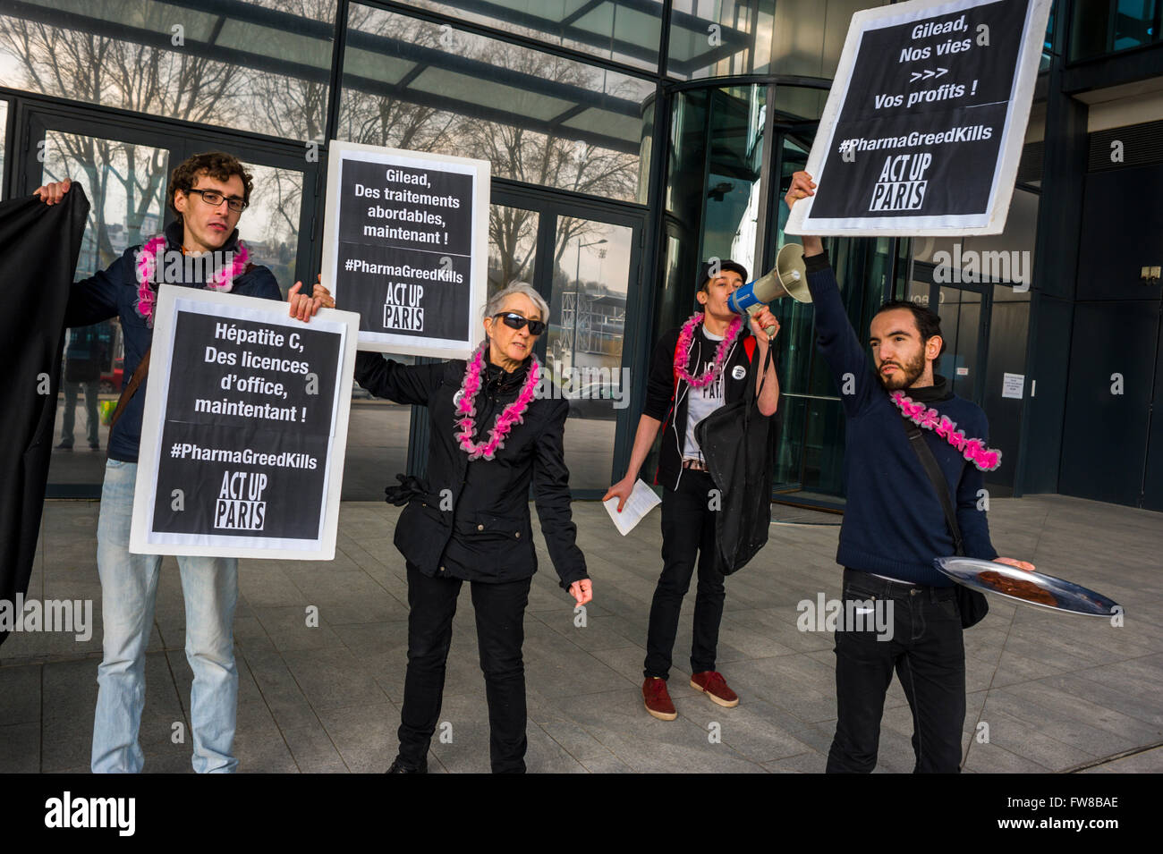 Paris, France, AIDS Activists, Act UP protest against Gilead Science Pharmaceuticals, to lower drug prices, front of Gilead France offices, Holding Protest Signs, big pharma protests, france pandemic people, collective action, drug pricing, France Protests Stock Photo
