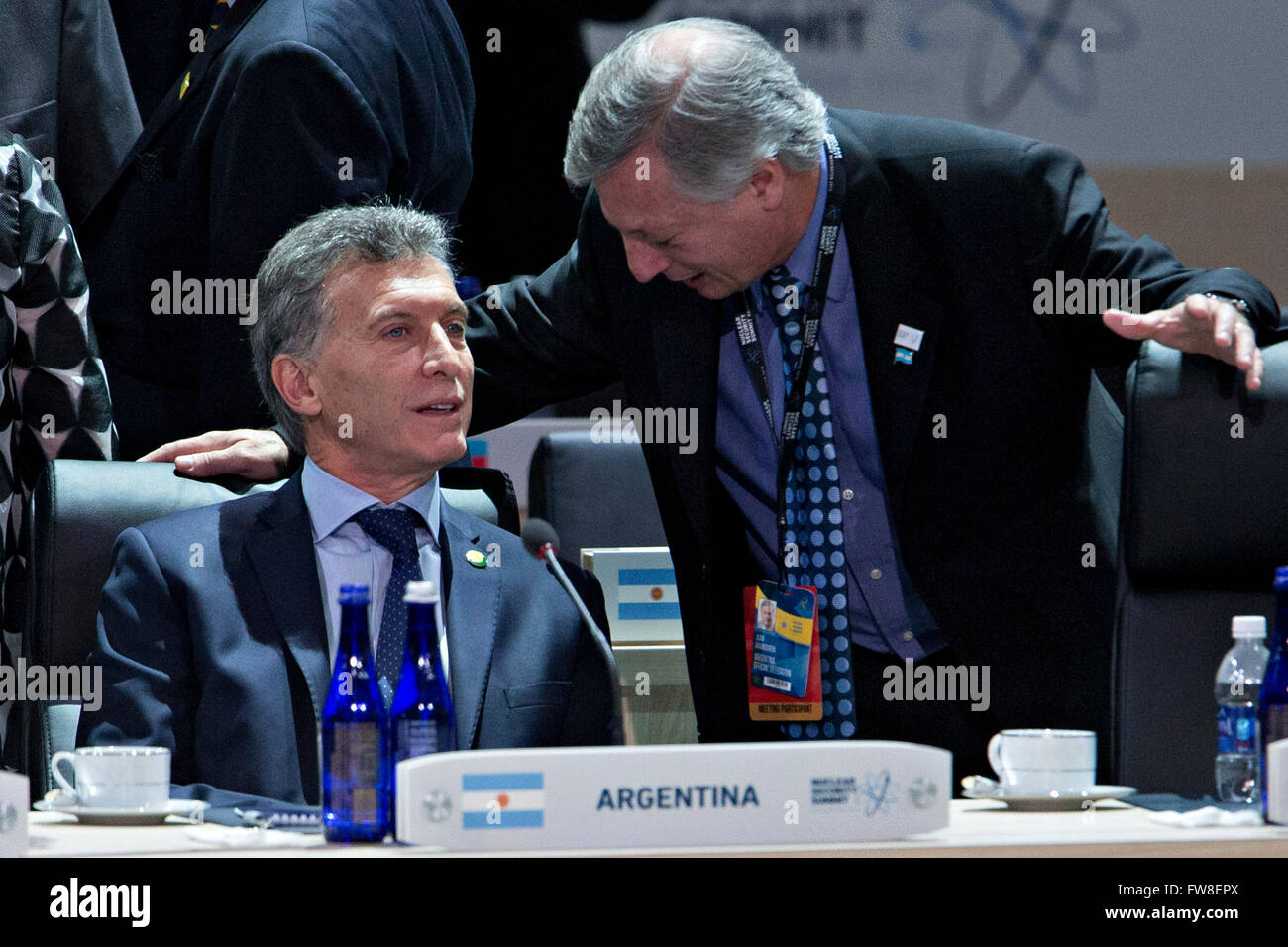 Washington, DC, USA. 1st Apr, 2016. Mauricio Macri, Argentina's president, left, waits to begin an opening plenary entitled 'National Actions to Enhance Nuclear Security' at the Nuclear Security Summit in Washington, DC, U.S., on Friday, April 1, 2016. After a spate of terrorist attacks from Europe to Africa, U.S. President Barack Obama is rallying international support during the summit for an effort to keep Islamic State and similar groups from obtaining nuclear material and other weapons of mass destruction. Credit: Andrew Harrer/Pool via CNP - NO WIRE SERVICE - © dpa/Alamy Live News Stock Photo