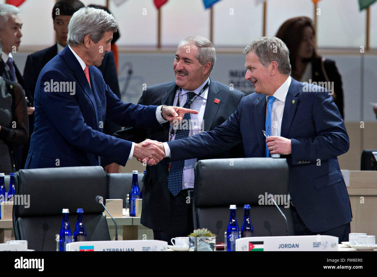 United States Secretary of State John Kerry, left, talks to Sauli Niinisto, Finland's president, right, and Nasser Judeh, Jordan's minister of foreign affairs, center, during a closing session at the Nuclear Security Summit in Washington, DC, U.S., on Friday, April 1, 2016. After a spate of terrorist attacks from Europe to Africa, U.S. President Barack Obama is rallying international support during the summit for an effort to keep Islamic State and similar groups from obtaining nuclear material and other weapons of mass destruction. Credit: Andrew Harrer/Pool via CNP - NO WIRE SERVICE - Stock Photo