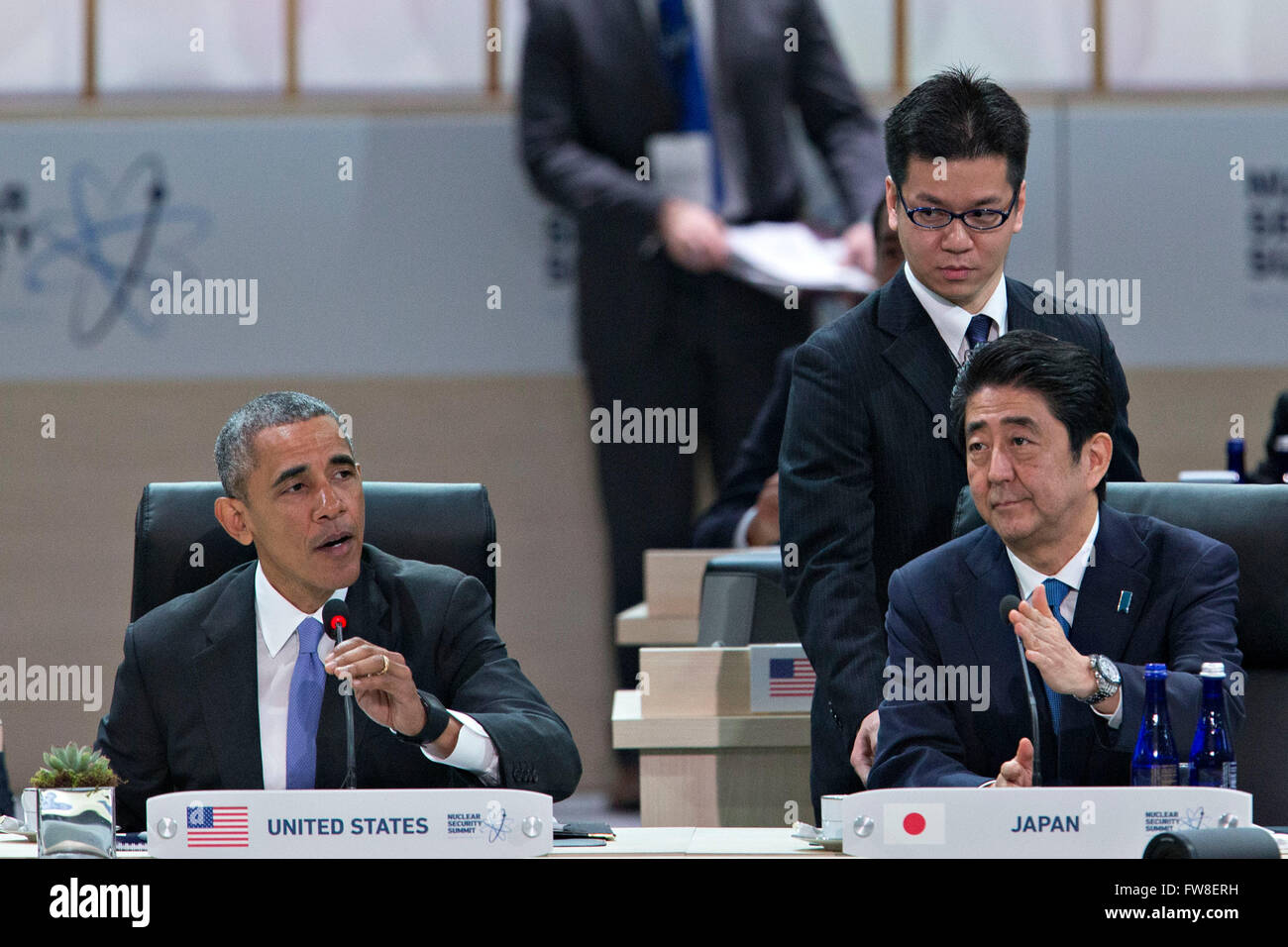 United States President Barack Obama, left, speaks as Shinzo Abe, Japan's prime minister, right, listens during an opening plenary entitled 'National Actions to Enhance Nuclear Security' at the Nuclear Security Summit in Washington, DC, U.S., on Friday, April 1, 2016. After a spate of terrorist attacks from Europe to Africa, Obama is rallying international support during the summit for an effort to keep Islamic State and similar groups from obtaining nuclear material and other weapons of mass destruction. Credit: Andrew Harrer/Pool via CNP - NO WIRE SERVICE - Stock Photo