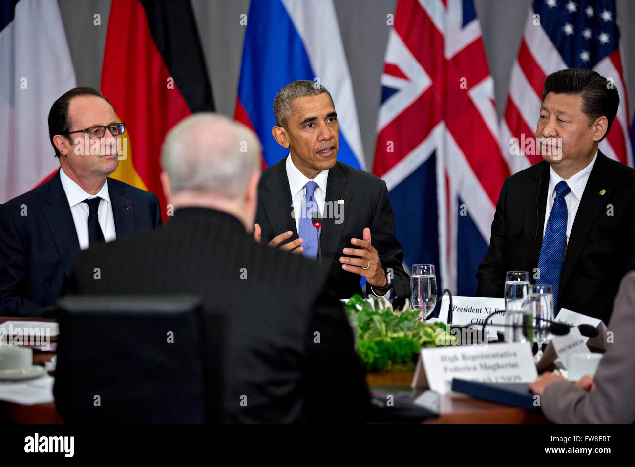 United States President Barack Obama, center, speaks as Xi Jinping, China's president, right, and Francois Hollande, France's president, left, listen during a P5 1 multilateral meeting at the Nuclear Security Summit in Washington, DC, U.S., on Friday, April 1. After a spate of terrorist attacks from Europe to Africa, Obama is rallying international support during the summit for an effort to keep Islamic State and similar groups from obtaining nuclear material and other weapons of mass destruction. Credit: Andrew Harrer/Pool via CNP - NO WIRE SERVICE - Stock Photo