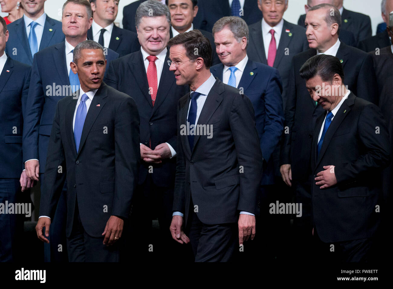 United States President Barack Obama, left, talks to Mark Rutte, Dutch prime minister, as they walk out of a family photo with Xi Jinping, China's president, right, at the Nuclear Security Summit in Washington, DC, U.S., on Friday, April 1, 2016. After a spate of terrorist attacks from Europe to Africa, Obama is rallying international support during the summit for an effort to keep Islamic State and similar groups from obtaining nuclear material and other weapons of mass destruction. Credit: Andrew Harrer/Pool via CNP - NO WIRE SERVICE - Stock Photo