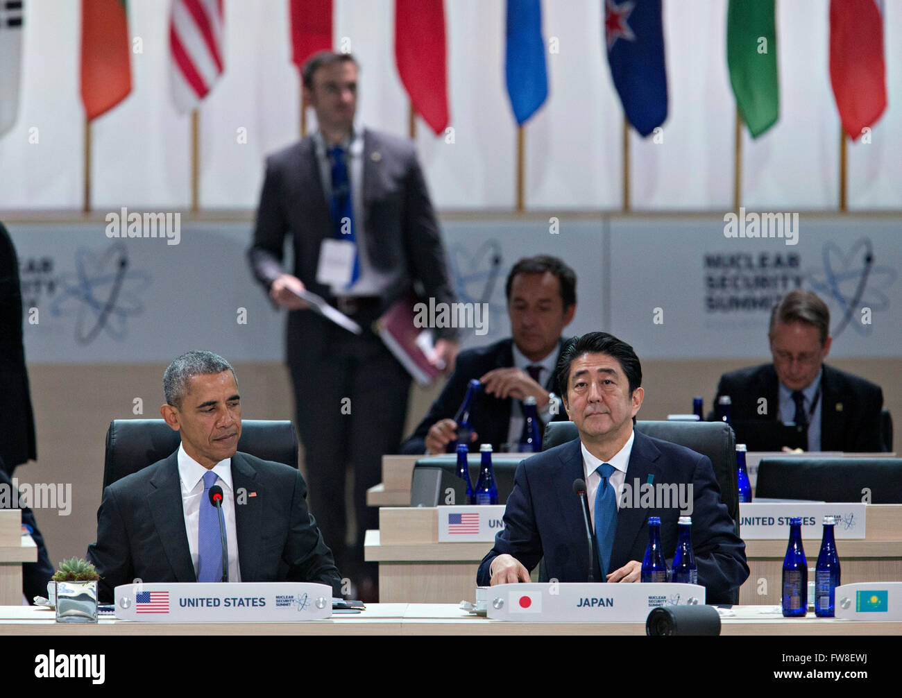 United States President Barack Obama, left, and Shinzo Abe, Japan's prime minister, wait to begin an opening plenary entitled 'National Actions to Enhance Nuclear Security' at the Nuclear Security Summit in Washington, DC, U.S., on Friday, April 1, 2016. After a spate of terrorist attacks from Europe to Africa, Obama is rallying international support during the summit for an effort to keep Islamic State and similar groups from obtaining nuclear material and other weapons of mass destruction. Credit: Andrew Harrer/Pool via CNP - NO WIRE SERVICE - Stock Photo
