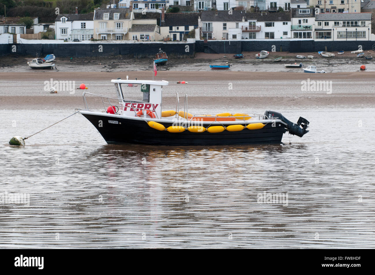 Passenger ferry moored in the river during low tide Stock Photo