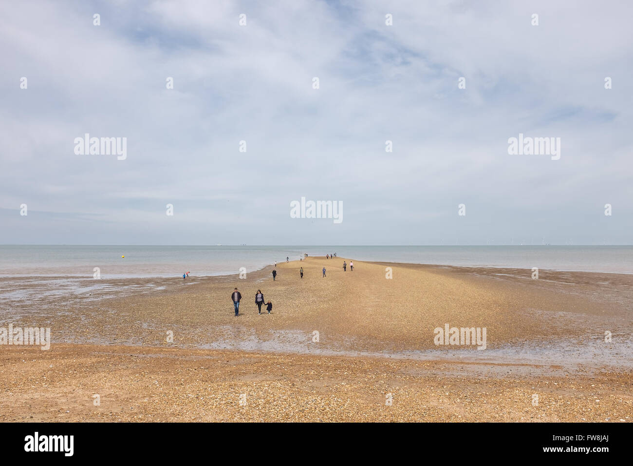 Families Walking on Shingle Beach, Tankerton, Kent, UK Stock Photo