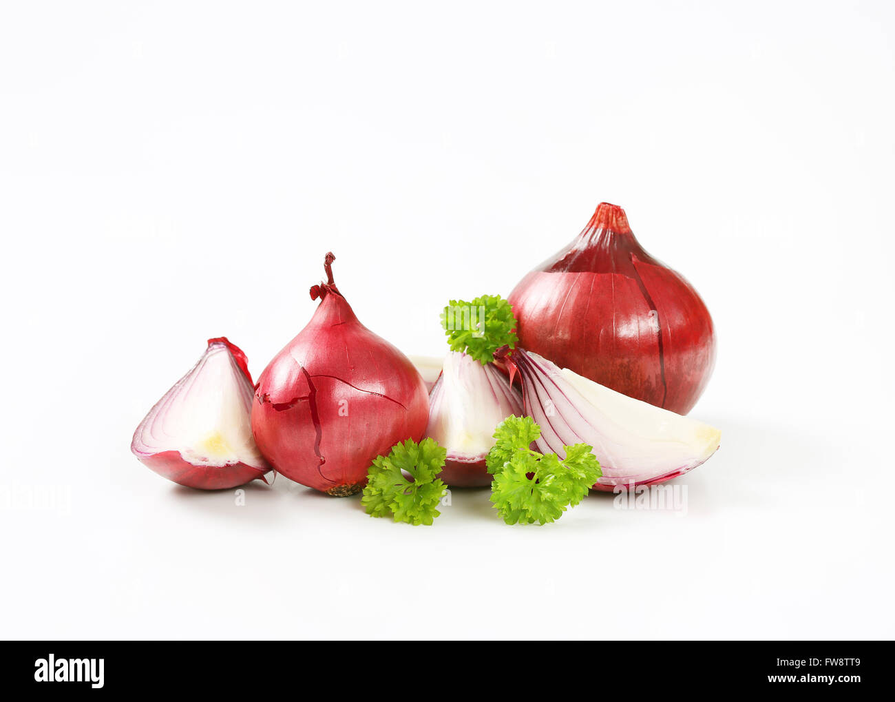 whole and sliced red onions on white background Stock Photo - Alamy