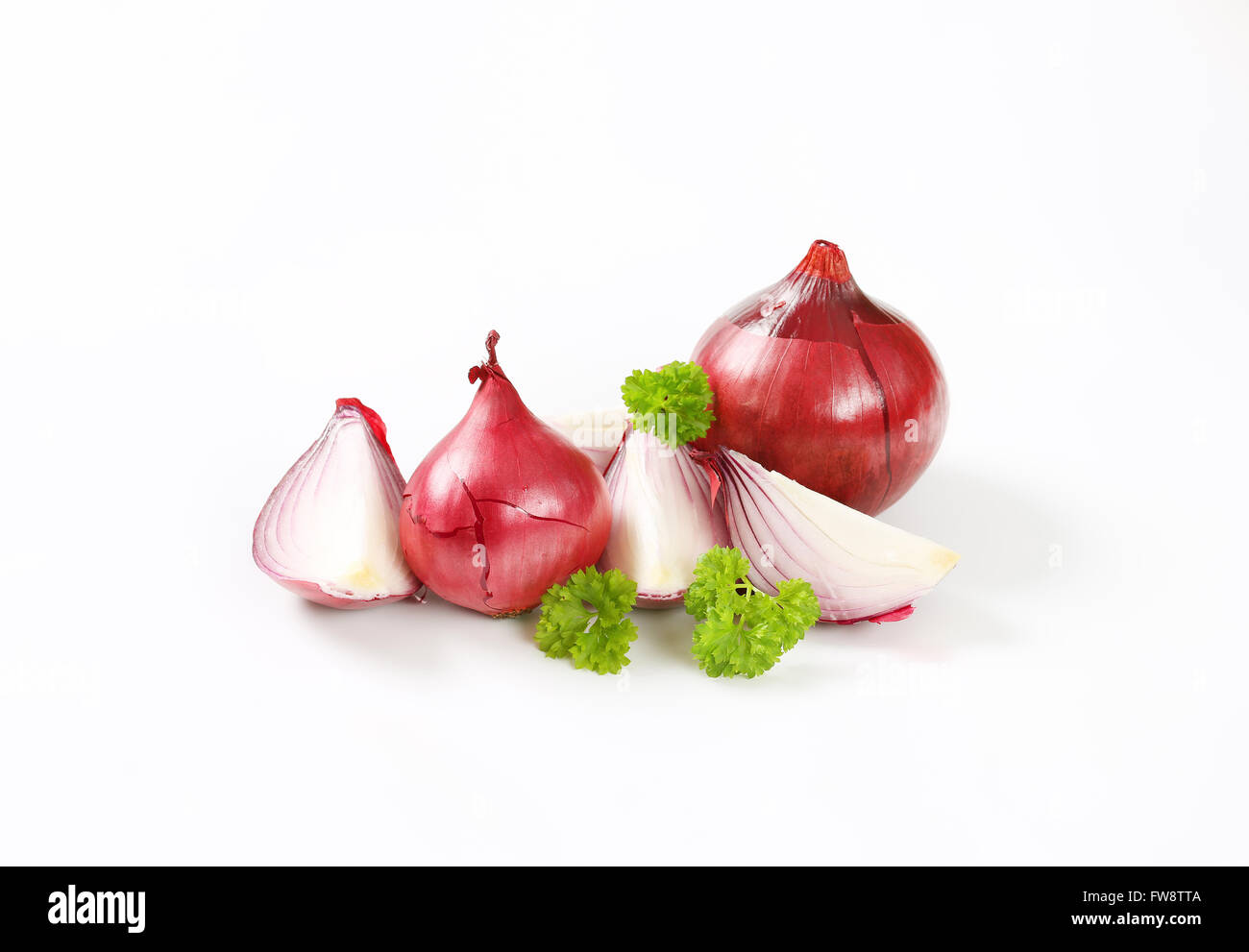 whole and sliced red onions on white background Stock Photo - Alamy
