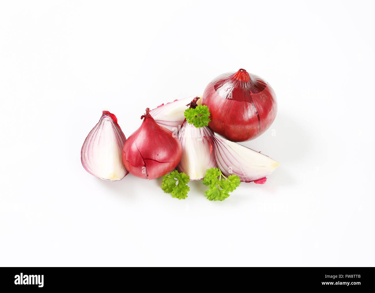whole and sliced red onions on white background Stock Photo - Alamy