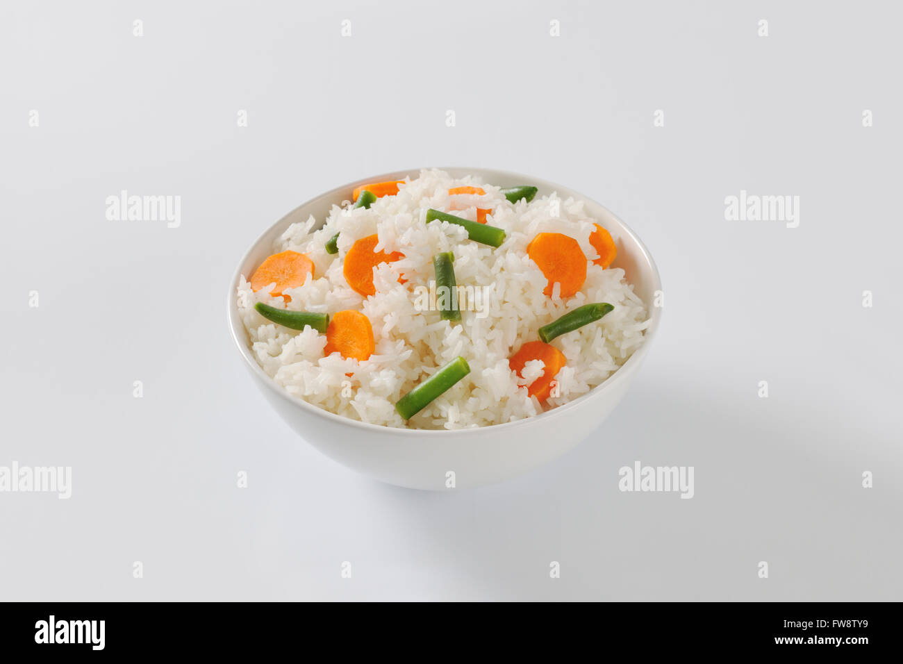 Bowl of Jasmine rice with carrot and string beans Stock Photo