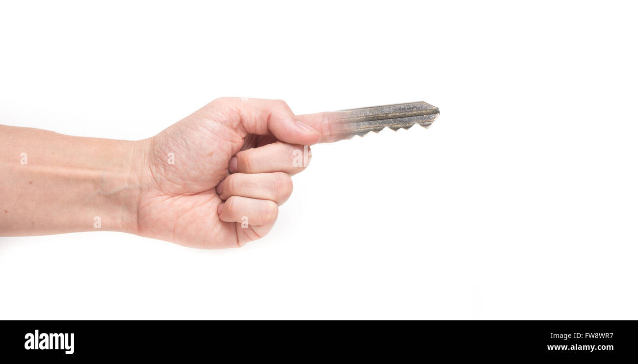 A man hand with a half metallic key half human finger Stock Photo