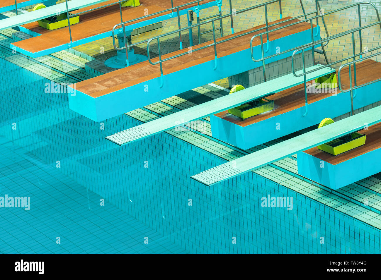 Several diving boards in the swimimg pool. Stock Photo